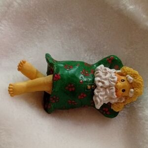 Green and Yellow Santa Figurine